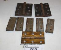 THREE PAIRS OF BRASS AND A PAIR OF CAST IRON HINGES