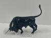 A BRASS PAINTED FIGURE OF A BULL, 9CM HIGH (TAIL)