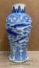 A CHINESE BLUE AND WHITE VASE DECORATED WITH FISH, FOUR CHARACTER MARK AT THE BASE. THE VASE HAS A METAL BRACE FITTED INTO THE NECK AND A SMALL HOLE NEAR THE FOOT PROBABLY CONVERTED INTO A LAMP BASE. 31.5CM HIGH
