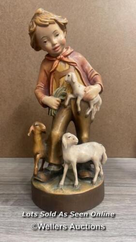 WALTER STAHLI WOOD CARVING OF A BOY WITH LAMBS, 30CM HIGH